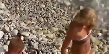 Perfect pale ass rides a cock on a beach