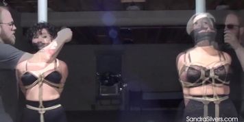 2086 Pole Tied Gorgeous Girdled MILFs Endure Crotch Rope, Boob Bondage, Wrap Gag & Blindfold! (Enchantress Sahrye, Sandra Silvers)