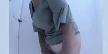 Mature woman caught in beach cabin