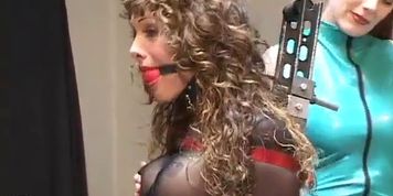Gagged and bound brunette gets off from screw machine