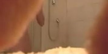 Voyeur cam in bathroom filmed a gal taking shower