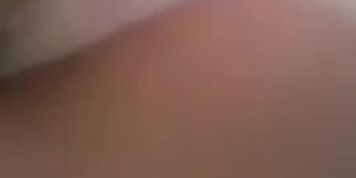 Petite girl in old style white shorts takes off her pink t-shirt and plays with small tits