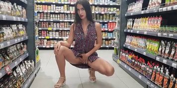 Girl Squats in the Store without Panties