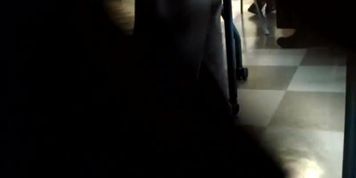 Candid Korean dangling under table during meeting