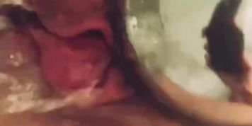 BBW MILF uses shower head to stimulate her big clitoris before finishing off with clit sucker