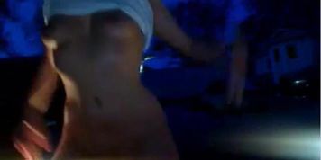 Slutty girl masturbating outside on a car