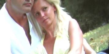 Blonde girl sitting upskirt in a park (no panties)