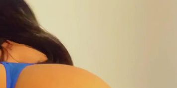 Latina in blue bikini masturbates with a pink vibrator