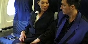 Brunette beauty wearing stewardess uniform gets fucked on a plane