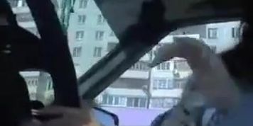 Man sitting in the car and playing with his member