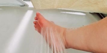 Washing my dirty soles (it tickles) 
