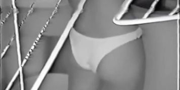 Nude Latin chick spied doing her laundry thru the window