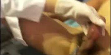 Asian doctor with surgical golves and mask give an injection cure to the slave