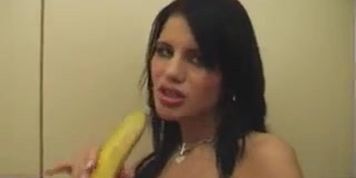 Busty girl strips and masturbates in a kitchen