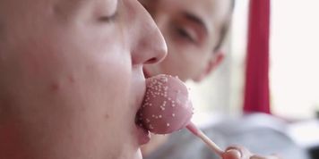 Twink gays licking lollypop and asses each other on the couch