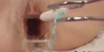 Speculum beauty spreading pussy before sucking dick