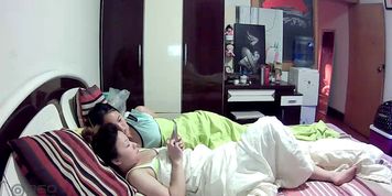 A pair of beautiful sisters lie on the bed