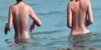 Nudist chicks in water and sunbathing