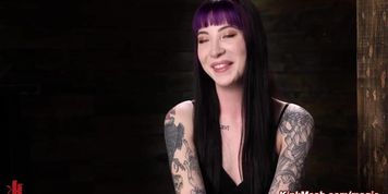 Tattooed slave suspended and tormented in upside down position