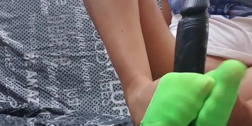 Footjob with big black toy. Sexy feet play hot