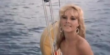 Carole Davis Breasts Scene  in Piranha Ii
