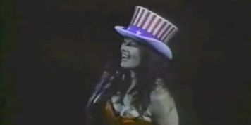 Lucy Lawless Breasts Scene  in Detroit Red Wings Game: National Anthem