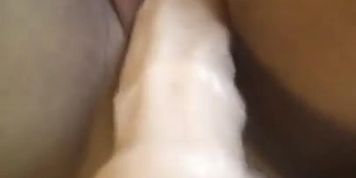 Huge dildo filling up my pussy while I cum on it