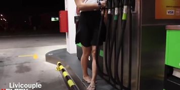 Miss_Livi undressing while pumping gas