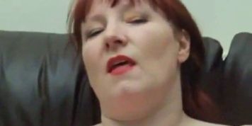 Amateur redhead plays with her tits