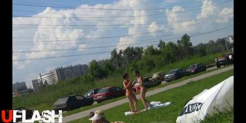 topless girl with mother at park