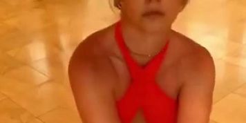 Britney Spears in red top and black bottoms