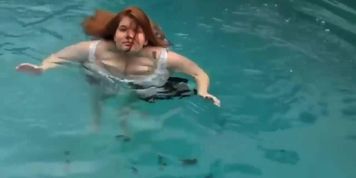 Enormous tits swimming
