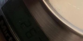 Carefully weighing my cock for ideal measures 
