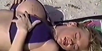 Huge Fake Boobs At The Beach