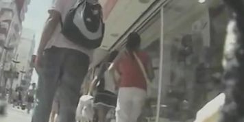 Upskirt hosts on the street by a professional voyeur and his spy camera