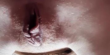 View of the cuckold from below while the girl is doing blowjob to her lover