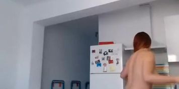 Long hair chick naked in the kitchen