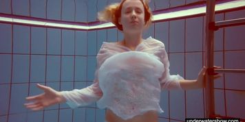 Cute Melissa plays underwater