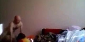 Bald man having fun with a girl