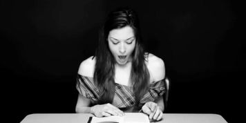 STOYA READING A BOOK WITH A VIBRATOR