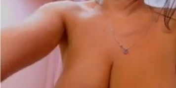 Busty brunette babe with big tits teasing and seducing on webcam