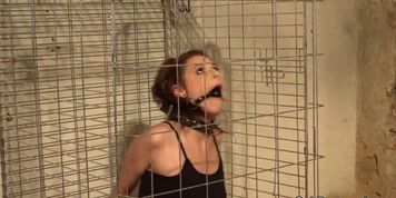 Caged beauty dominated and restrained