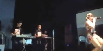 Upskirt of a girl singing on the stage
