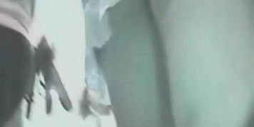 Upskirt video shots of a long legged beauty