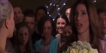 Blonde bride gets her face pushed into the wedding cake