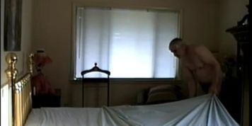 NUDE MAKING A BED