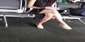 Candid Asian Legs waiting at the airport