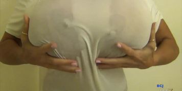 Huge fake boobs in shower