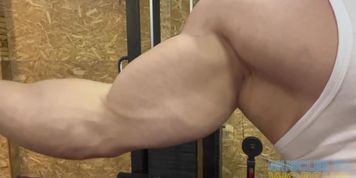Bodybuilder Showing Off In The Gym