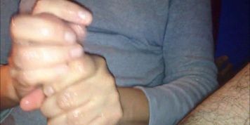 She strokes his cock while he tapes